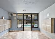 Thumbnail 7 of 10 - A room with a pool visible through the glass door.