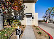 Thumbnail 1 of 5 - A sign in front of a building that says "LEARNING CENTER".