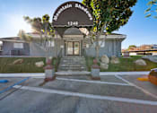 Thumbnail 5 of 20 - The image shows a building with a sign that reads "Mountain Shadows 1240".