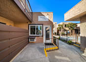 Thumbnail 2 of 5 - The entrance to a building with a sign that reads "Harvest House.".