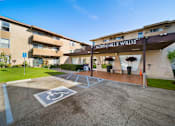 Thumbnail 5 of 8 - A parking lot in front of North Hills Willis apartment building.