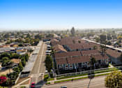 Thumbnail 16 of 16 - A residential area with houses and a clear sky.
