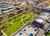 Thumbnail 3 of 17 - A bird's eye view of a residential area with houses and trees.