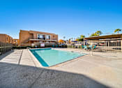 Thumbnail 5 of 11 - A swimming pool in front of a modern building.