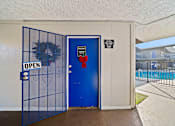 Thumbnail 9 of 11 - A blue door with a sign that says "OPEN" on it.