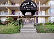 Thumbnail 4 of 8 - A black sign with white lettering reads Southoaks Pointe Apartments 6628.