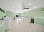 Thumbnail 13 of 13 - A laundromat with wash and dry sections.