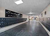 Thumbnail 10 of 15 - A long hallway with Studio Pointe Apartments written on the wall.