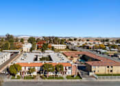 Thumbnail 5 of 6 - A view of a residential area with houses and trees.