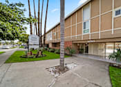 Thumbnail 4 of 13 - A building with a sign that says "Torrance Square" in front of it.