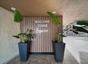 Thumbnail 5 of 13 - A sign that says "Welcome to Wyne Square" is on a wall.