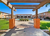 Thumbnail 12 of 70 - A view of a building with a walkway leading to it.
