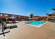 Thumbnail 28 of 70 - A pool area with a clear blue sky above.