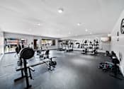 Thumbnail 33 of 70 - A gym with a variety of exercise equipment.
