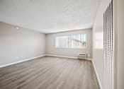 Thumbnail 49 of 70 - A room with a window and a radiator on the wall.