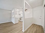 Thumbnail 51 of 70 - A kitchen area with a white cabinet and a white oven.
