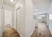 Thumbnail 69 of 70 - A white bathroom with wood flooring and a toilet.