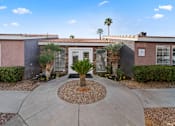 Thumbnail 2 of 17 - A house with a palm tree in front.