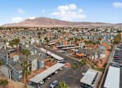Thumbnail 5 of 21 - A residential area with houses and a mountain in the background.