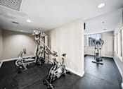 Thumbnail 21 of 75 - A spacious gym with a variety of exercise equipment.