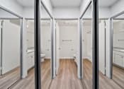 Thumbnail 38 of 75 - A spacious bathroom with a vanity and a toilet.