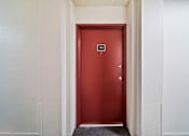 Thumbnail 7 of 75 - A red door with a number 10 on it.
