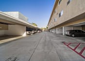 Thumbnail 12 of 12 - A parking garage with a car parked in the first level.