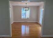 Thumbnail 19 of 25 - A room with a wooden ceiling and a window with blinds.