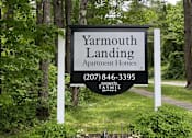 Thumbnail 1 of 15 - a sign for yarmouth landing apartment homes in front of trees
