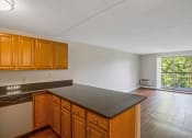 Thumbnail 11 of 37 - Taymil Andover Place Living Room and Kitchen