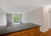 Thumbnail 15 of 37 - Taymil Andover Place Living Room and Kitchen