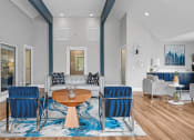 Thumbnail 7 of 14 - Living room with blue chairs and a couch  at Harrison Grande, North Carolina, 27513
