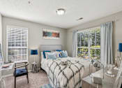 Thumbnail 5 of 27 - A bedroom with a large bed and a window with blinds at The Atlantic Canton Ridge, Georgia