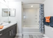 Thumbnail 7 of 18 - Bathroom with a shower and a sink and a bath tub at The Atlantic at Tradition, Florida, 34987