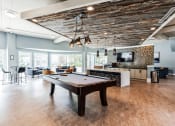 Thumbnail 6 of 14 - a game room with a pool table and a tv at Harrison Grande, Cary, NC