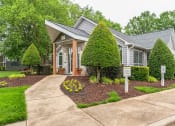 Thumbnail 14 of 14 - a small gray house with a driveway and a sign in front of it  at Harrison Grande, Cary, NC, 27513