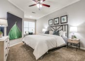 Thumbnail 5 of 10 - Bedroom With Comfortable Bed and Ceiling Fan at The Atlantic Stone Oak Apartments, Texas, 78260