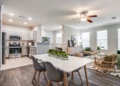 Thumbnail 4 of 10 - Kitchen and Dining Room area at The Atlantic Stone Oak Apartments, San Antonio, TX 78260