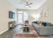 Thumbnail 6 of 15 - Living room with a couch at The Atlantic North Highland, Charlotte