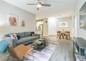 Thumbnail 7 of 15 - A living room with a grey couch at The Atlantic North Highland, Charlotte