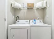 Thumbnail 13 of 15 - White washer and dryer laundry room at The Atlantic North Highland, Charlotte