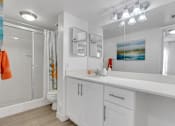 Thumbnail 23 of 23 - A bathroom with a white counter and a white sink at Boca Colony Apartments, Boca Raton, FL, 33433
