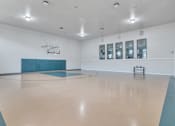 Thumbnail 13 of 13 - Multipurpose room has a basketball court and a large window at The Atlantic Mira Loma, Live Oak, 78233