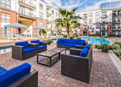 Thumbnail 9 of 34 - A patio with a pool and chairs  at The Atlantic Memorial, Houston