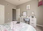 Thumbnail 7 of 24 - A bedroom with a bed, desk, and chair.at The Atlantic Canton Ridge, Canton, GA  