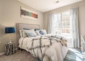 Thumbnail 8 of 24 - A bedroom with a large bed and a painting on the wall.at The Atlantic Canton Ridge, Canton  