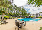 Thumbnail 14 of 24 - A pool area with chairs and a table.at The Atlantic Canton Ridge, Canton, 30114  