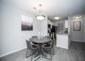 Thumbnail 7 of 13 - Model. Kitchen and Dining Room area.