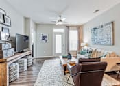 Thumbnail 4 of 15 - Living room with a couch and a tv at The Atlantic Mountain Island, Charlotte, North Carolina