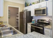 Thumbnail 8 of 11 - Model. Kitchen. at The Atlantic BridgeMill, Canton, 30114